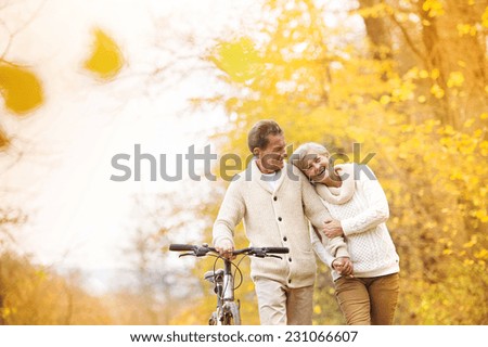 Image, Stock Photo Senior couple enjoying autumn colors together