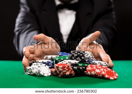 casino, gambling, poker, people and entertainment concept - close up of poker player with chips at green casino table ストックフォト © 