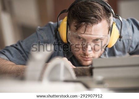 Similar – Image, Stock Photo Repairman with headphones in workshop