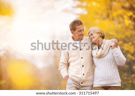 Similar – Image, Stock Photo Senior couple in autumn park