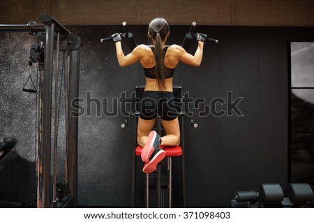 Similar – Image, Stock Photo Female athlete doing pull up exercises