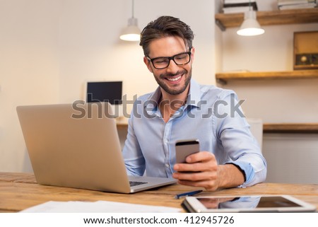 Similar – Image, Stock Photo Young Man smiling while talking to someone on his laptop.