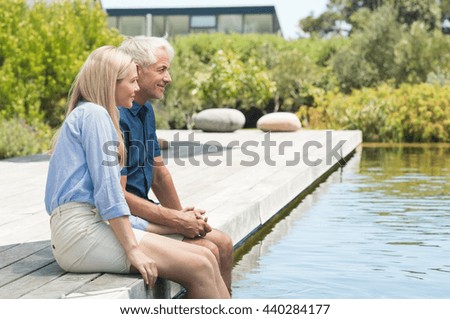 Similar – Image, Stock Photo Mature couple swimming together in fresh water