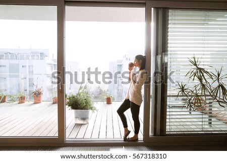 Similar – Image, Stock Photo Woman standing on balcony looking over the ocean