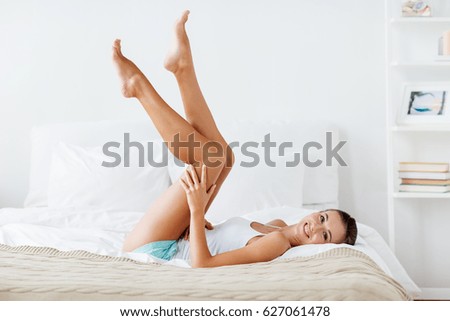 Similar – Image, Stock Photo Smiling woman lying in bed with dog