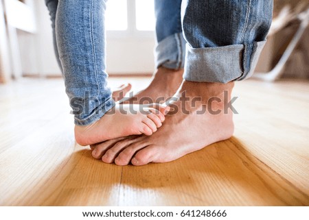 Similar – Image, Stock Photo Father with daughter barefoot on grass