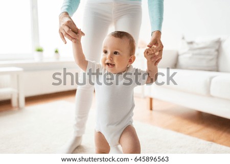 Similar – Image, Stock Photo Young mom walking with her baby during covid pandemic