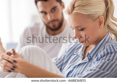 people, relationship difficulties, conflict and family concept - unhappy couple having quarrel in bed at home Foto stock © 