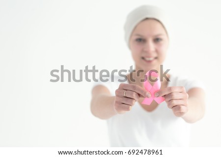 Similar – Image, Stock Photo Woman with pink scarf for cancer looking at the sea in bikini from the beach