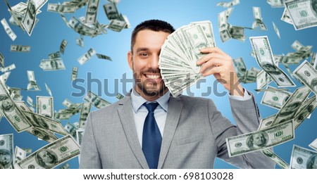 a businessman holding cash