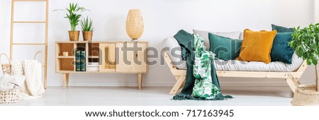 Similar – Image, Stock Photo Vintage sofa in moss green velvet with fringes stands on terracotta tiles. Coziness, old fashioned, past