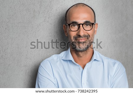 Similar – Image, Stock Photo Portrait of mature man with grey beard exploring Finland in winter. Traveler with camera on the top of rock. Beautiful view of northern landscape with frozen Baltic Sea and snowy islands.