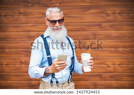 Similar – Image, Stock Photo Trendy man in sunglasses against blue wall
