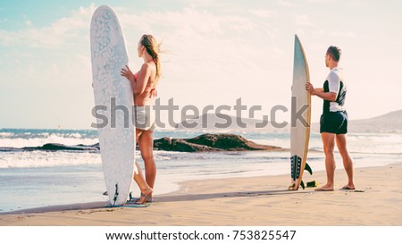 Similar – Image, Stock Photo Surfing couple waiting for the wave