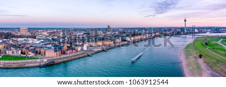 Similar – Foto Bild Blick auf die Düsseldorfer Skyline bei Sonnenuntergang