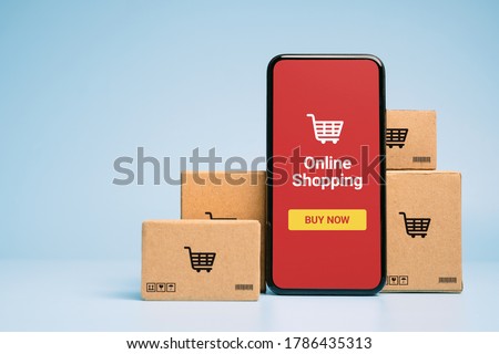 Concept online Sopping. boxes and shopping bag with Smartphone Online Shopping screen. Stock photo © 