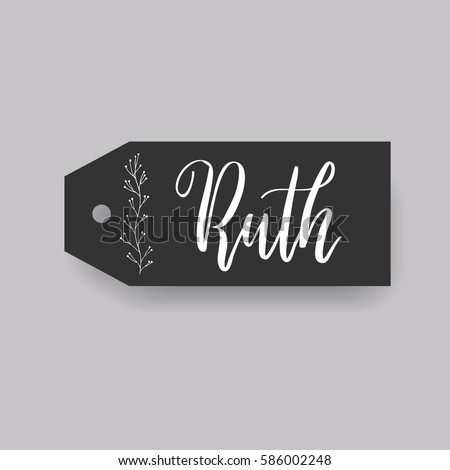 Girl name Ruth. Calligraphy lettering. Black badge decorated with botanical element and female name. Can be used as place card on wedding or anniversary.