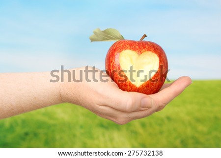 Delicious Apple with heart bite