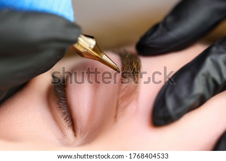 Similar – Image, Stock Photo Master doing tattoo on forearm of male customer