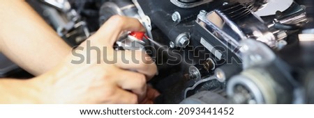 Similar – Image, Stock Photo Technician oiling bike chain in workshop