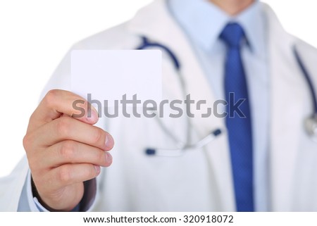 Male medicine doctor hand holding blank calling card. Physician showing white visiting card in camera closeup. Contact information exchange concept. Introducing gesture at formal meeting