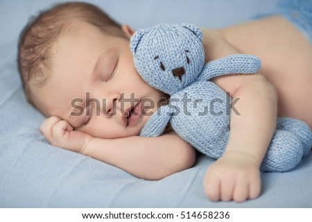 Similar – Image, Stock Photo Lovely and curious newborn lying down in her little bed