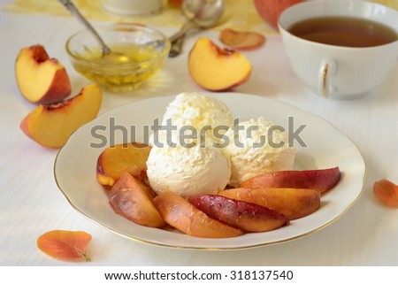 Roasted peaches with honey and cream cheese, selective focus
