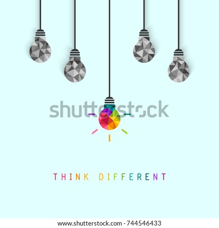 Think different concept with creative and colorful lightbulb being more unique than the surrounding grey ones