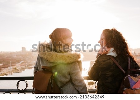 Similar – Image, Stock Photo two women sightseeing Porto views by the river and taking picture with mobile phone. Travel and friendship concept