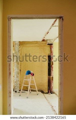 Similar – Foto Bild Leiter, blauer Schutzhelm und Ohrenschützer auf der Baustelle. Heimwerken, Renovierung