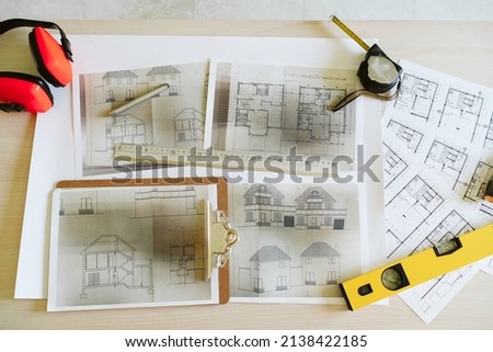 Similar – Foto Bild Baupläne, Gehörschutz, Schutzbrille und Werkzeuge am Arbeitsplatz des Architekten auf der Baustelle