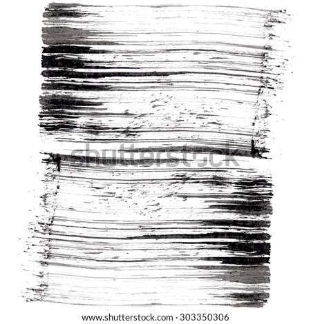 Short black paint brush stroke texture on white background. Black and white graphic effects. Ink texture on white paper.