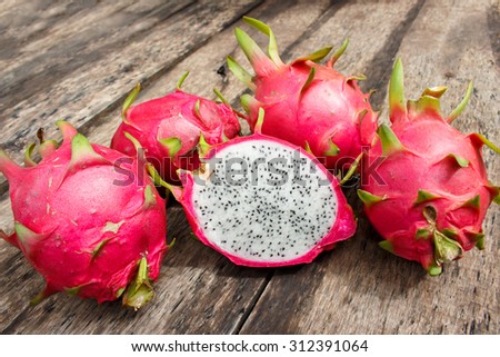 Dragon Fruit On old Wooden Table