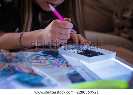 Similar – Image, Stock Photo Girl playing with mosaic board game