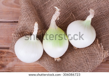 white onions on a wooden background