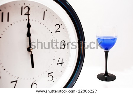 clock and glass with stem like clock hand