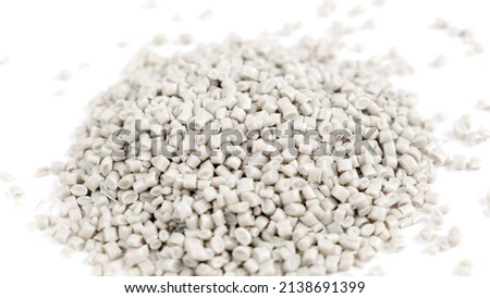 Secondary granule made of polypropylene, white Plastic pellets crumbles to the table. Plastic raw materials in granules for industry. Polymer resin. Raw plastic recycling concept Foto d'archivio © 