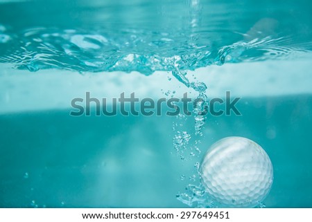 Golf ball in the water for background.