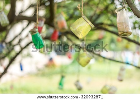 Wishing bottle hanging on a tree