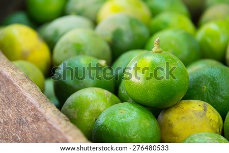 lime, green lime in wood box selling at the market, Thailand