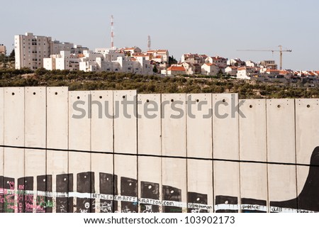 BETHLEHEM, PALESTINIAN TERRITORIES - MARCH 10: Construction continues in the Israeli settlement of Gilo, separated from the West Bank town of Bethlehem by the Israeli separation wall, March 10, 2012.