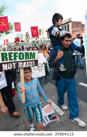 WASHINGTON, DC - MAY 1: Immigrants and their supporters march to the White House on International Workers\' Day, to call for legal reforms and an end to workplace raids May 1, 2009 in Washington, DC.