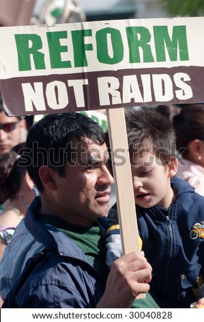 WASHINGTON, DC - MAY 1, 2009: On International Workers\' Day, immigrant families and their supporters march to the White House to call for legal reforms and an end to workplace raids in Washington on May 1, 2009