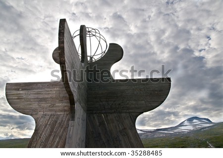 NORWAY: A large wooden compass marks the Arctic Circle in a region where snow previously covered these mountain tops year round, but they now lie exposed due to global warming and climate change.