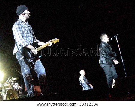 LANDOVER, MD - SEPT 29, 2009: The Edge, guitarist of the Irish rock band U2, performs live with vocalist Bono and bassist Adam Clayton at FedEx Field during the band\'s \