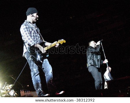 LANDOVER, MD - SEPT 29, 2009: The Edge, guitarist of the Irish rock band U2, performs live with vocalist Bono and bassist Adam Clayton at FedEx Field during the band\'s \
