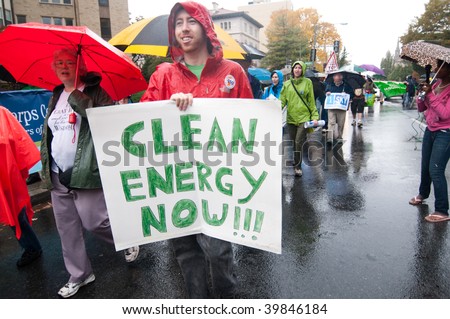 WASHINGTON, DC - OCTOBER 24: An environmental activist holds a sign saying, \