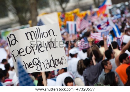 WASHINGTON, DC - MARCH 21: Some 200,000 immigrants\' rights activists flood the National Mall to demand comprehensive immigration reform on March 21, 2010 in Washington DC.