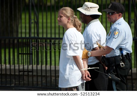 WASHINGTON, DC - MAY 1: Immigration reform activists are arrested for blocking the sidewalk on May 1, 2010 at the White House in Washington, DC.