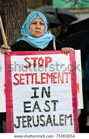 EAST JERUSALEM - FEBRUARY 11: An unidentified Palestinian woman protests Jewish settlements in the Sheikh Jarrah neighborhood of East Jerusalem on Feb. 11, 2011.